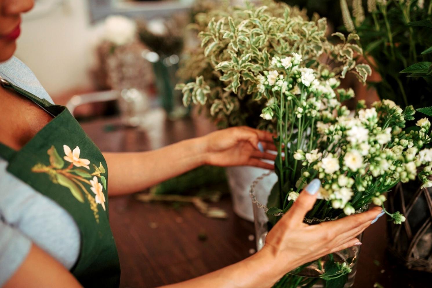 Detailed view of premium flowers being selected for corporate arrangements